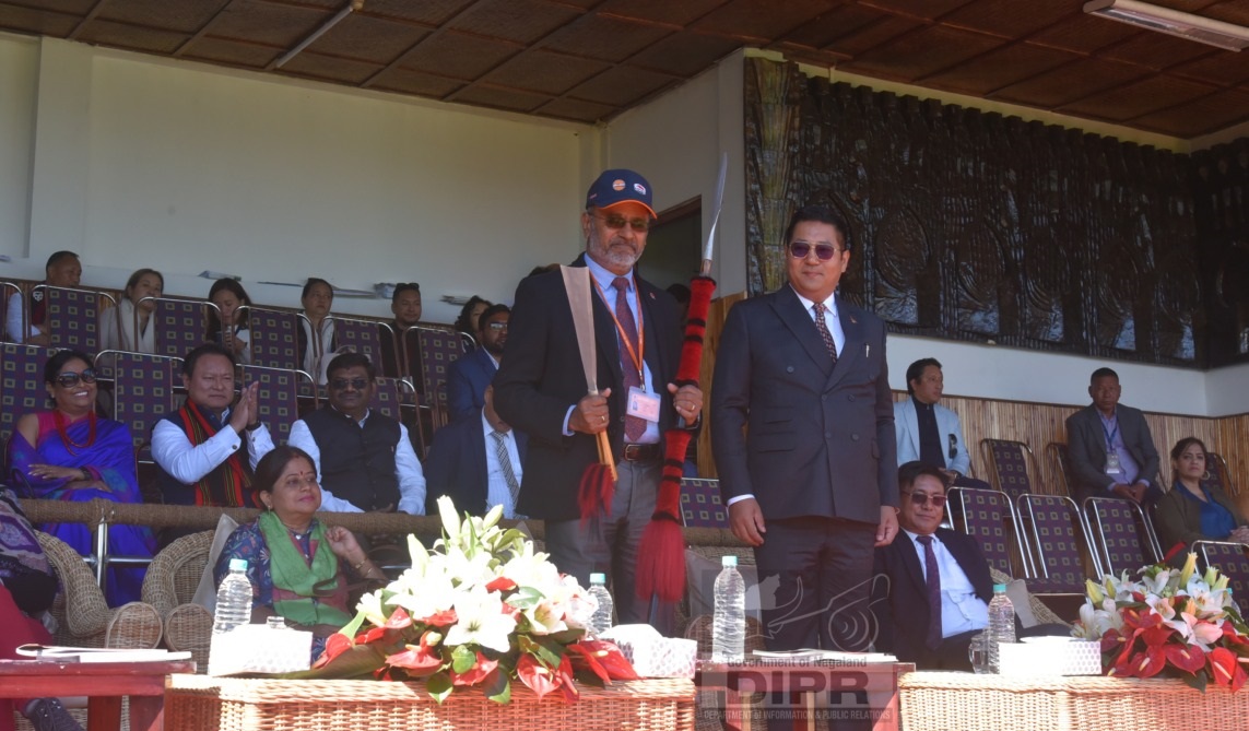 G. Ramesh, ex. Director being presented with a naga spear